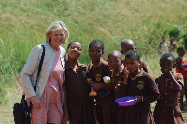 Mary Matheson, founder of SPARK University, with a group of students from Emvembili Primary School in Swaziland, Africa